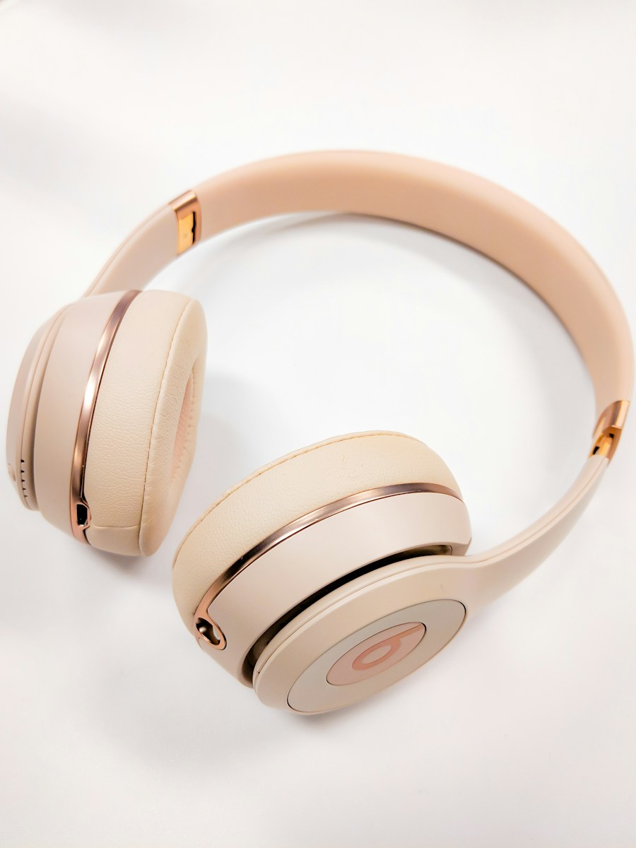 Cream over-ear headphones with gold detailing
